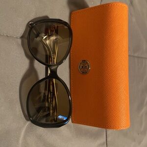 Gently used TB sunglasses with case.